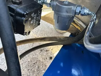 Industrial fuel filter installed on Nilfisk DTE 500HM hot pressure washer during contaminated fuel repair in Leicester.